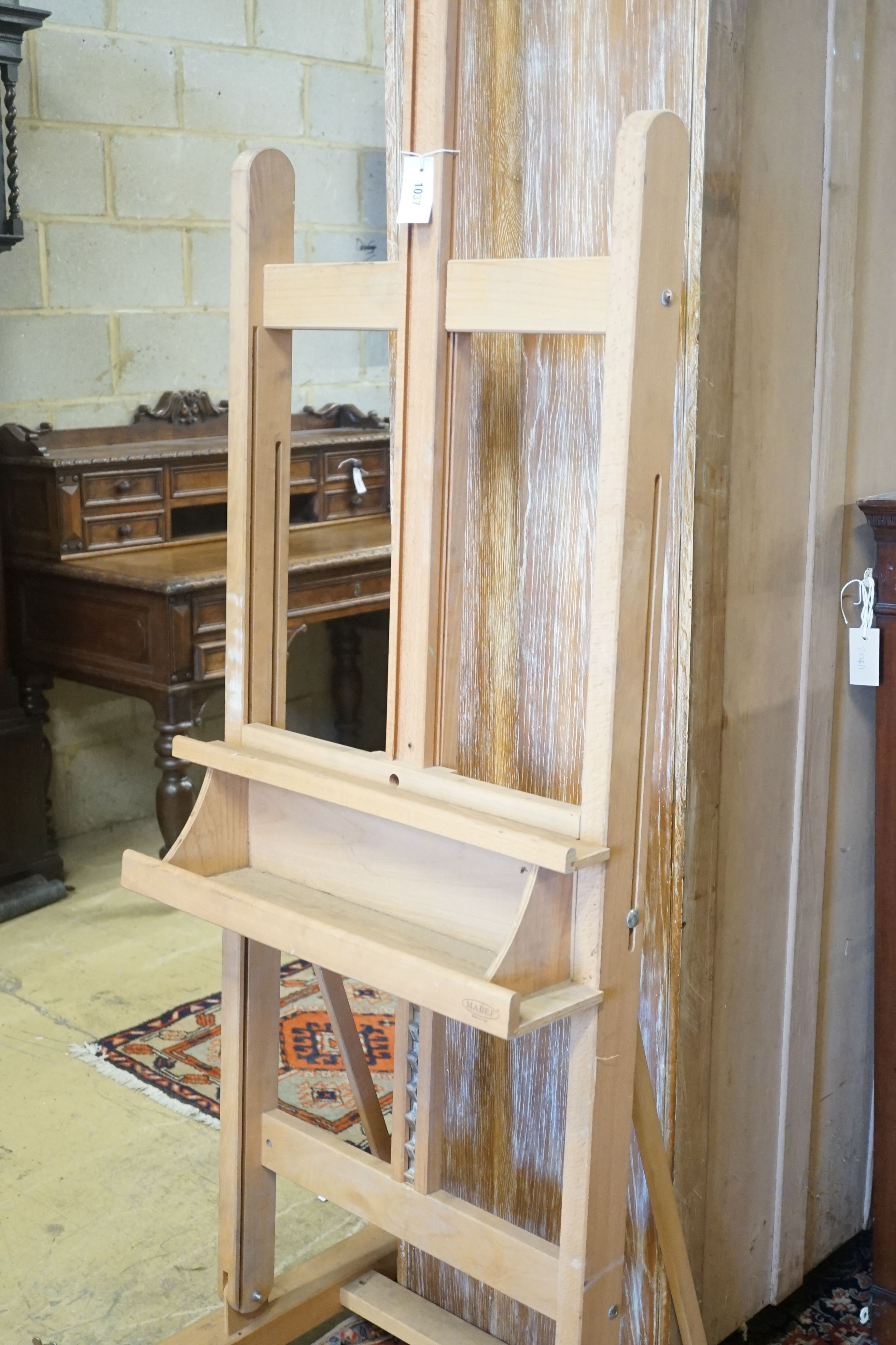 An Italian beech artist studio easel by Mabef, width 60cm height 188cm